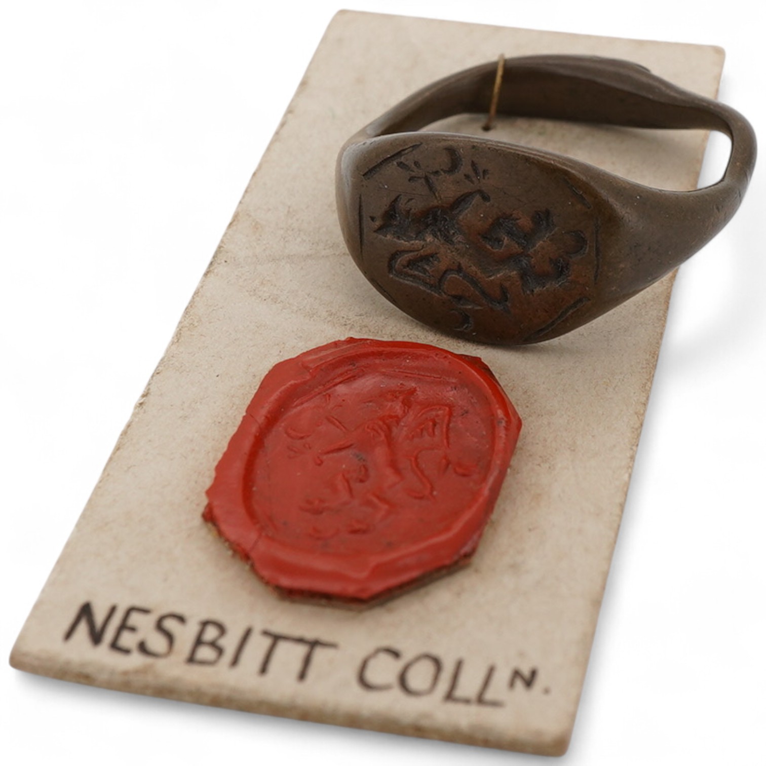 A Tudor bronze heraldic signet ring, England, circa 1500, the octagonal panel depicting a griffon rampant, to a plain band, size L1/2, Provenance: formerly in the collection of Dame Joan Evans (1893-1977), By repute, fro